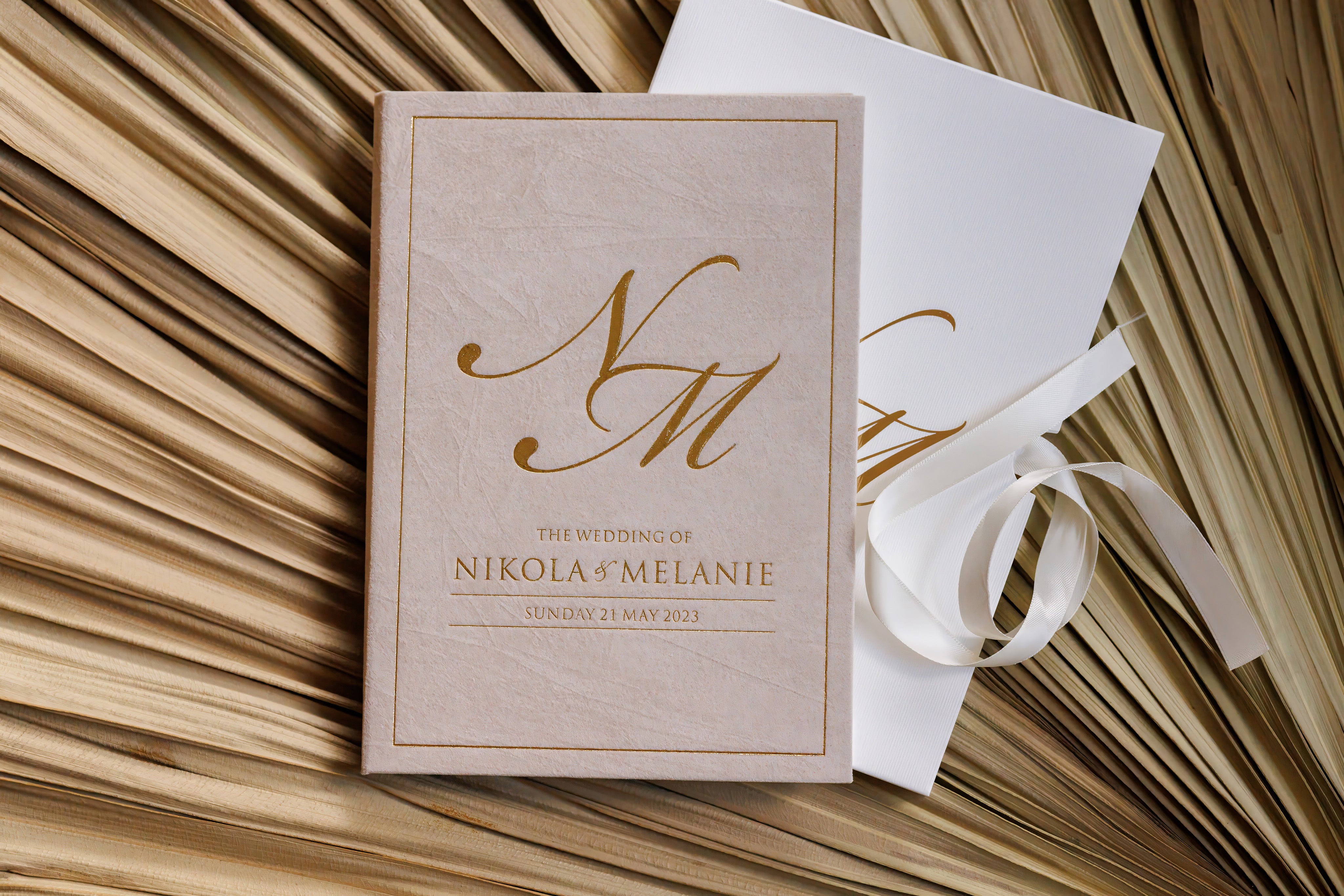 Beautiful luxury hardcover wedding invitation that is wrapped in a premium velvet finish and stamped with foil